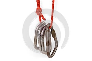 Several different locking and non-lockingÃ¢â¬â¹ carabiners on rope loop photo